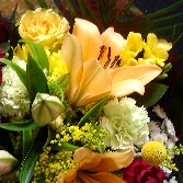 Mixed Hand tie H T6 with peach lillies, yellow roses and yellow scented fresias